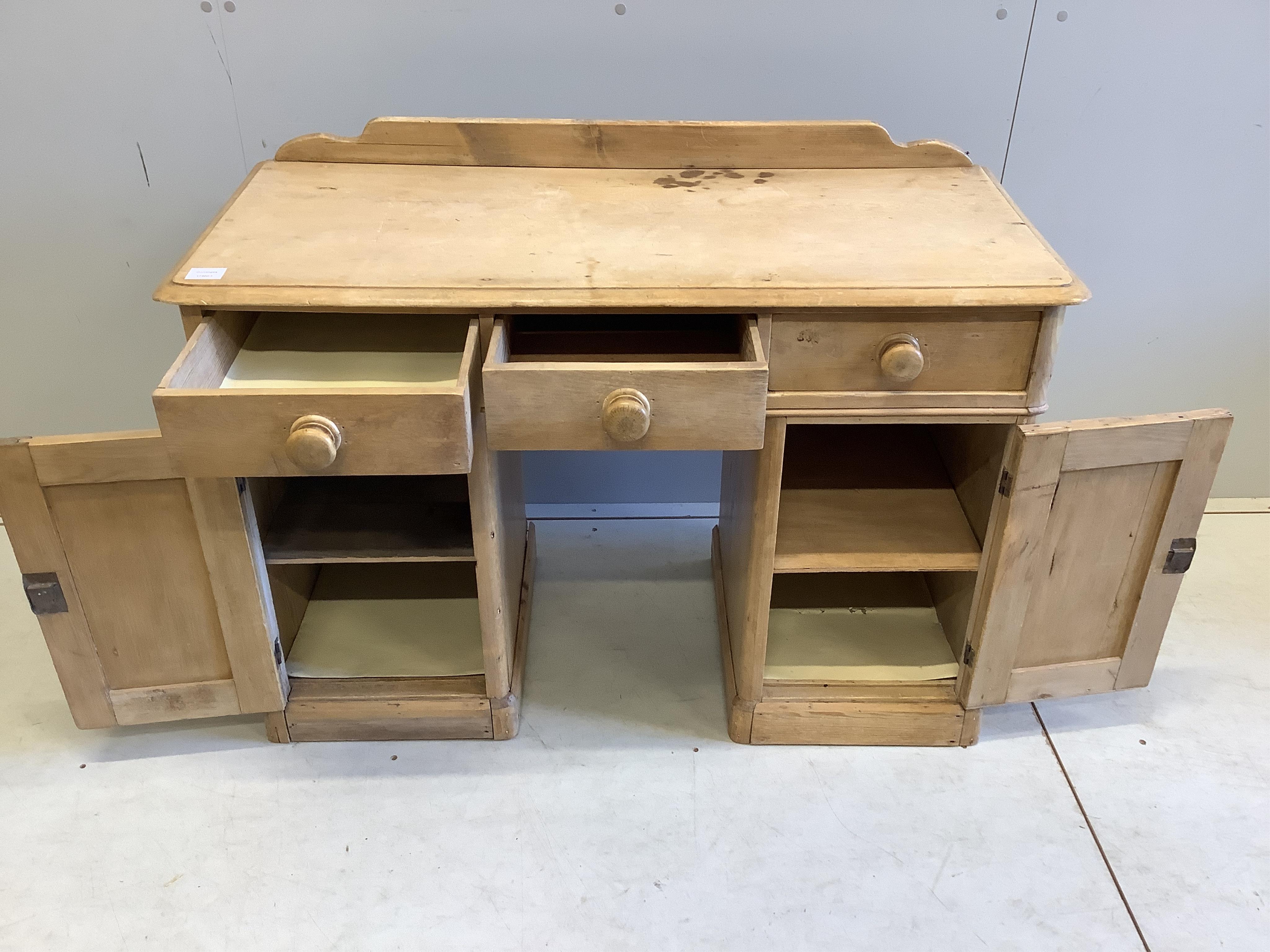 A Victorian pine kneehole dressing table, width 106cm, depth 46cm, height 80cm. Condition - fair